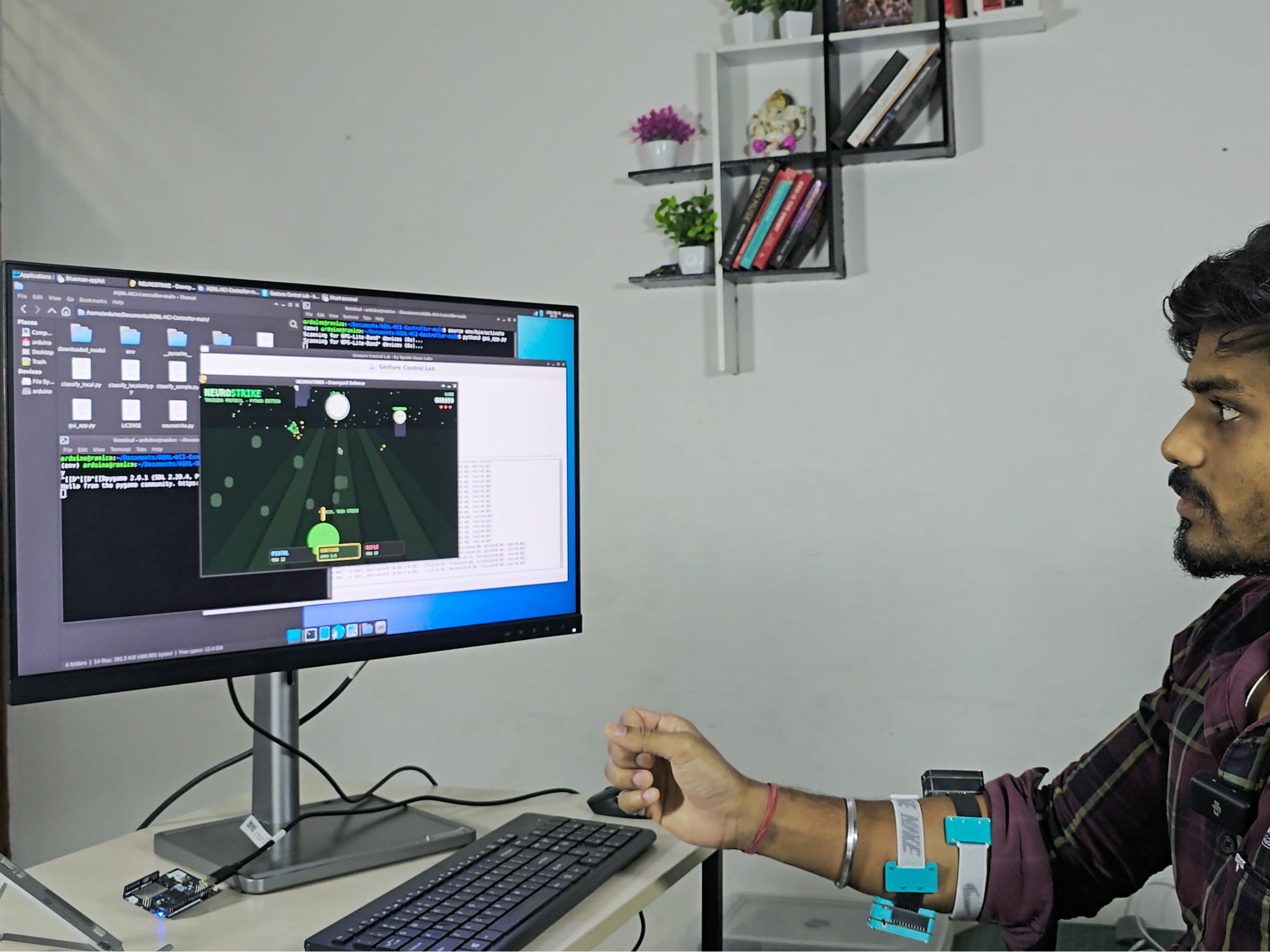Person wearing NPG Lite Armbands on the forearm, playing a gesture-controlled game